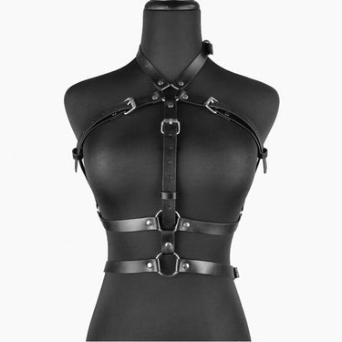 a mannequin wearing a black leather harness